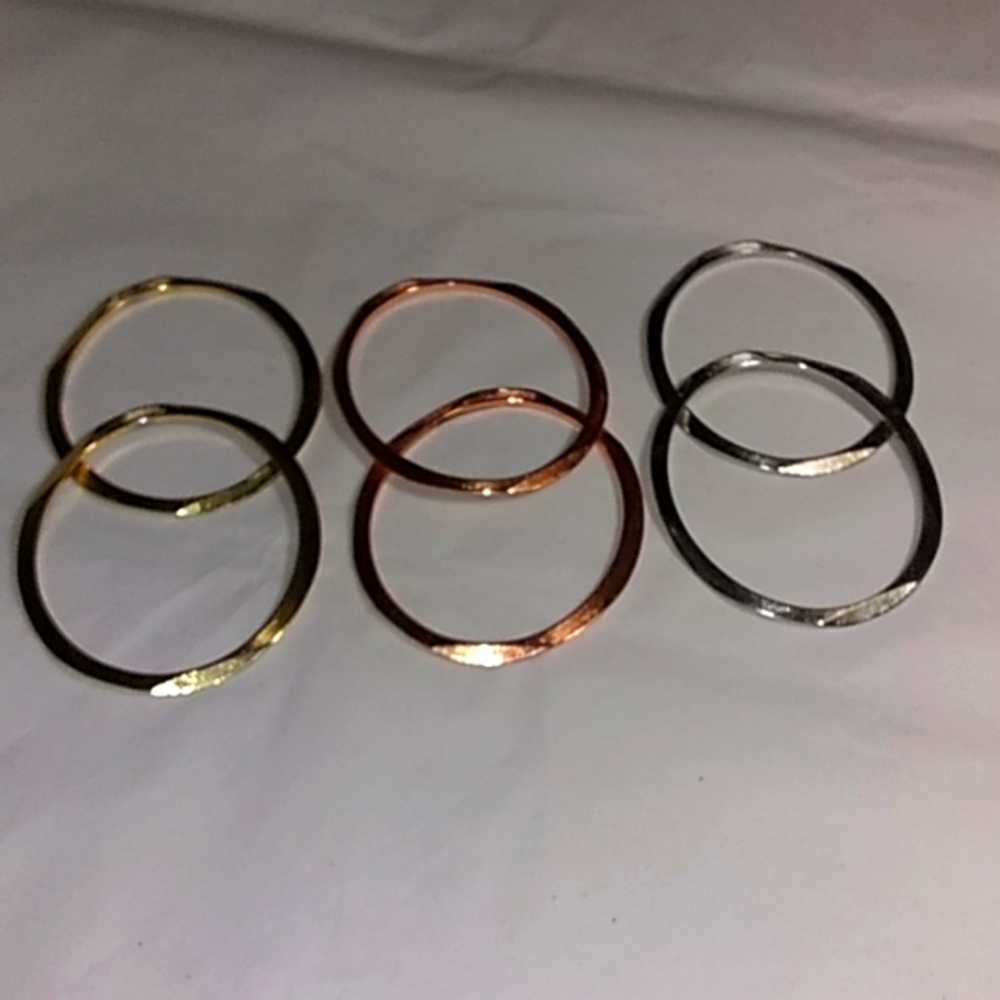 6 TRI color metal bracelets.